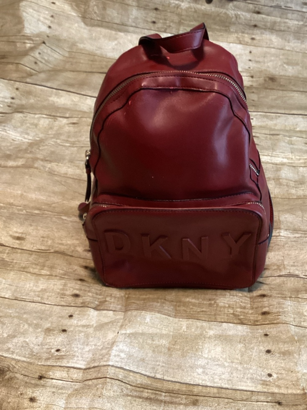 DKNY  Women Deep Burgundy Leather Backpack with Embossed Logo